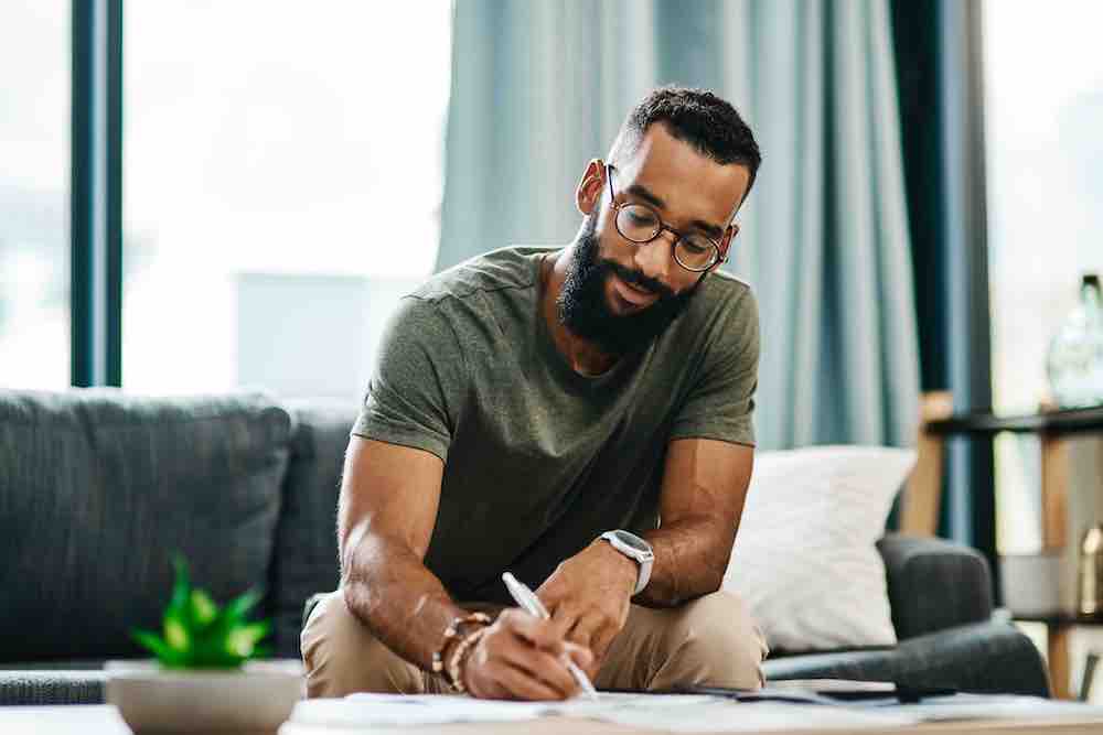 Man going reviewing his Will and Trust documents at home