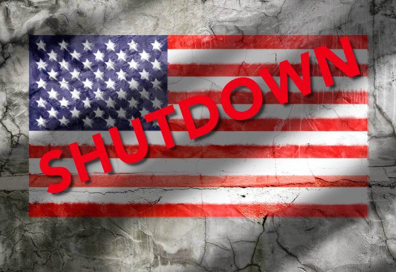 Illustration of United States Flage with the word SHUTDOWN written across the flag